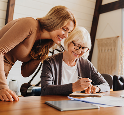 Woman and mother going over paperwork at a desk