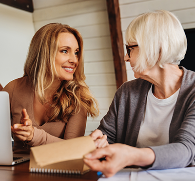 Woman and mother going over paperwork at a desk