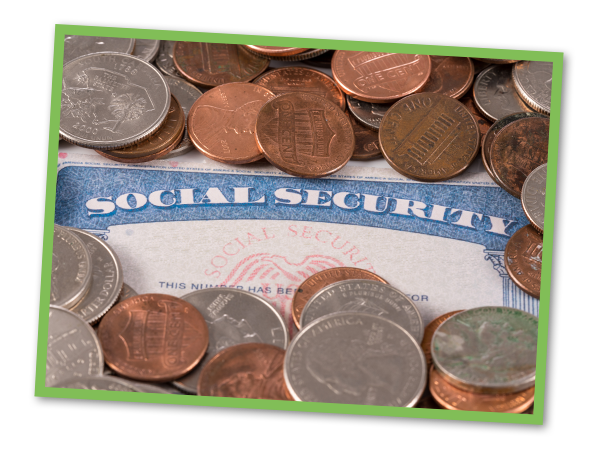 Social security card with coins covering it.